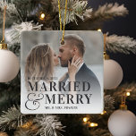 Bold Married & Merry Wedding Photo Newlywed Ceramic Ornament<br><div class="desc">Display a favorite wedding photo with this bold,  modern typography-based Christmas design,  featuring "married & merry" overlaid in black lettering joined by an oversized ampersand. Personalize with your wedding date and names. Design repeats on reverse side.</div>