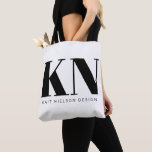 Bold Modern Monogram Name Custom Black White Tote Bag<br><div class="desc">This chic and stylish tote bag is designed with bold, customisable initials and a name or business name in a minimalist black and white style, perfect for personal or professional branding. The spacious bag makes it ideal for carrying everything from books to groceries, showcasing your unique brand or initials wherever...</div>
