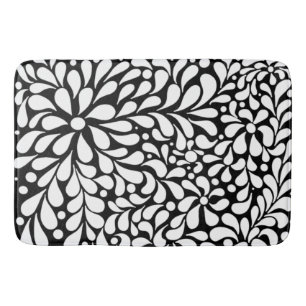 Bold modern white flowers on black background bath mat