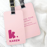 Bold monogram initial and name pink burgundy luggage tag<br><div class="desc">Luggage tag featuring your monogram initial in a big,  bold font and your name below. Burgundy text on a pink background. Colours are customisable in the design tool. Add your contact information on the back.</div>