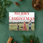 Bold Typography Merry Christmas Photo Red Holiday Card<br><div class="desc">This modern and elegant holiday card features your photo with overlapping large type. The back features a second photo and a spot for additional text,  with a snowfall pattern background. All fonts and colours are editable.</div>