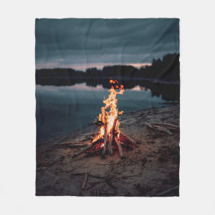 Bonfire near body of water during night time fleece blanket