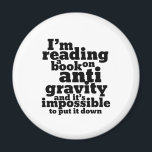 Book on Anti Gravity Funny Science Geek Puns Magnet<br><div class="desc">I'm reading a book on anti gravity and it's impossible to put it down. Funny science pun design for those who love to study science. Cool and humourous quote merchandise for college students majoring in Physics. Perfect for scientist and physicist. Great Christmas gift and birthday present for family and friends....</div>