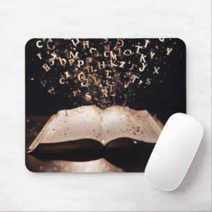 Book With Flying Letters and Sparkles Mouse Pad