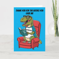 Bookwormosaurs rex sitting in chair reading book