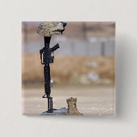 Boots, rifle, dog tags, and protective helmet