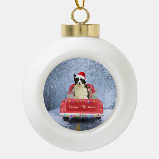 Border Collie Dog in Snow sitting in Christmas  Ceramic Ball Christmas Ornament (Front)