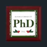 Border Green Holly Name Year PhD Graduation Gift Box<br><div class="desc">A square Phd graduation keepsake box with a Christmas feel. The top has a decorative border and a holly berry and leaf accents. It has a green and white colour scheme and shows the degree, name, and year. Simply customise this box, add it to your cart, and give it to...</div>