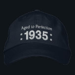 Born in 1935 AGED TO PERFECTION 80th Birthday V2DC Embroidered Hat<br><div class="desc">Born in 1935 AGED TO PERFECTION 80th Birthday V2DC. This embroidered hat makes a special birthday gift.  Customise the year and sentiment!</div>