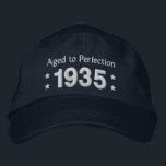 Born in 1935 AGED TO PERFECTION 80th Birthday V2DC Embroidered Hat<br><div class="desc">Born in 1935 AGED TO PERFECTION 80th Birthday V2DC. This embroidered hat makes a special birthday gift.  Customise the year and sentiment!</div>