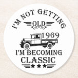born in 1969 vintage birthday mens gift round paper coaster<br><div class="desc">You can add some originality to your wardrobe collection with this vintage classic truck graphic design with awesome typography font lettering, which is a great gift idea for men, women, husbands, wife grandma, and grandpa who will love this one-of-a-kind artwork. The best amazing and funny holiday present for your happy...</div>