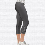 Botanical Om Symbol High Waisted Capri Leggings<br><div class="desc">Colourful botanical pattern Om symbol is tiled on the waistband, the capri leggings are dark grey. Name in light grey on outside of right calf. Easily change or remove name using the Template provided. There is ample room for a full name or other text. Sizes from XS (0-2) to XL...</div>
