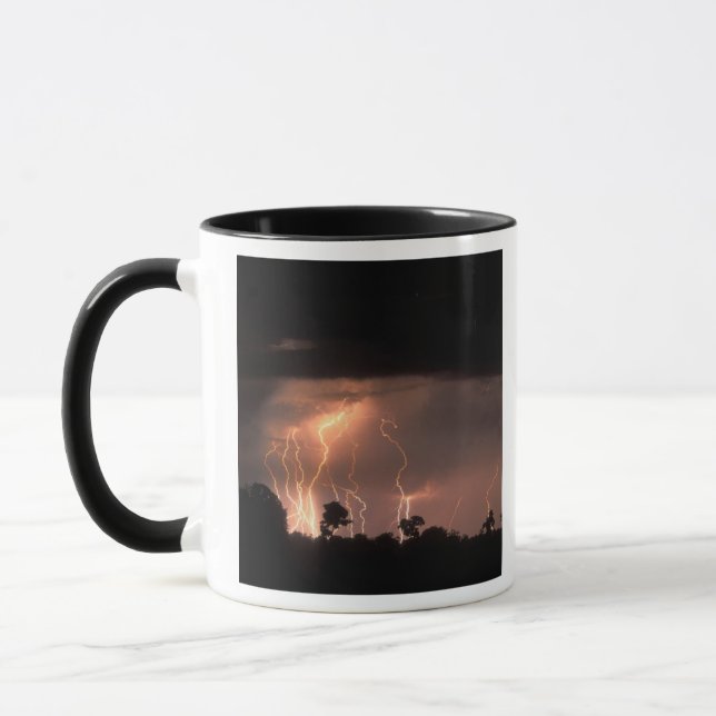 Botswana, Moremi Game Reserve, Lightning fills Mug (Left)