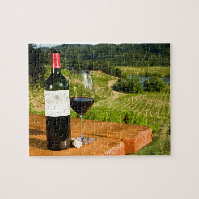Bottle of red wine and glass on table jigsaw puzzle (Horizontal)