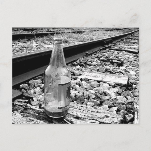 BOTTLE ON TRAIN TRACK POSTCARD (Front)