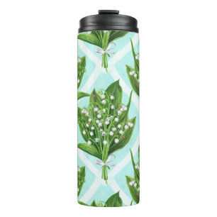 Bouquet of lilly of the valley flowers on blue thermal tumbler