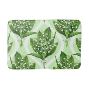 Bouquet of lilly of the valley flowers on green bath mat