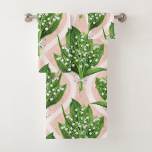 Bouquet of lilly of the valley flowers on green bath towel set