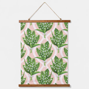 Bouquet of lilly of the valley flowers on green hanging tapestry