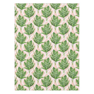 Bouquet of lilly of the valley flowers on green tablecloth