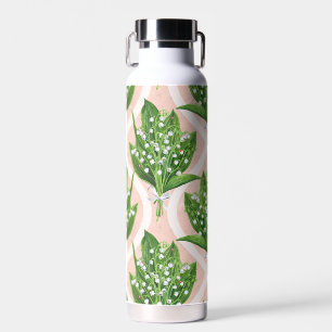 Bouquet of lilly of the valley flowers on green water bottle