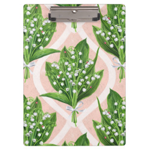 Bouquet of lilly of the valley flowers on pink clipboard