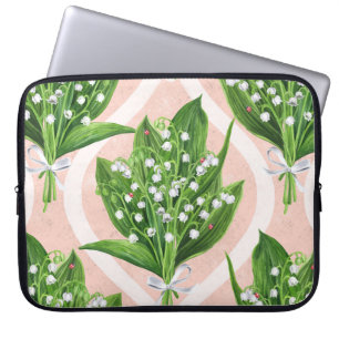 Bouquet of lilly of the valley flowers on pink laptop sleeve