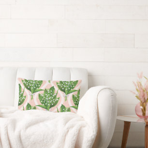 Bouquet of lilly of the valley flowers on pink lumbar cushion
