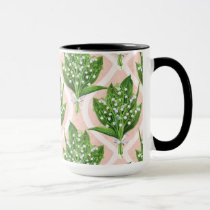 Bouquet of lilly of the valley flowers on pink mug
