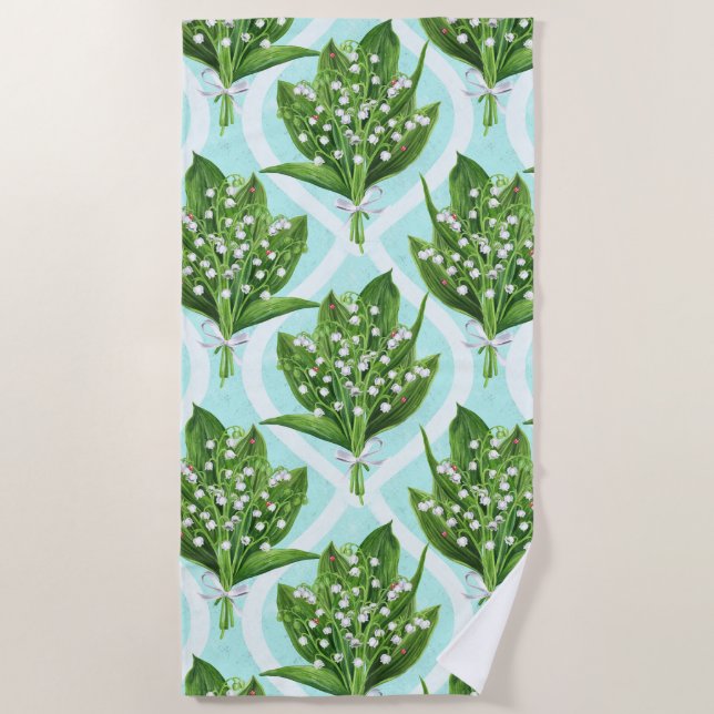 Bouquet of lily of the valley flowers on blue beach towel (Front)