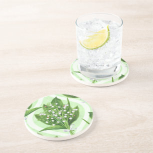 Bouquet of lily of the valley flowers on blue coaster