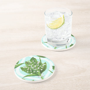 Bouquet of lily of the valley flowers on blue coaster