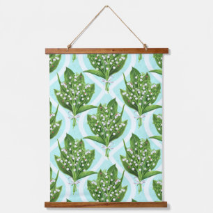 Bouquet of lily of the valley flowers on blue hanging tapestry