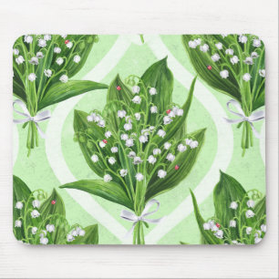 Bouquet of lily of the valley flowers on blue mouse pad