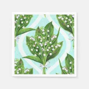 Bouquet of lily of the valley flowers on blue napkin