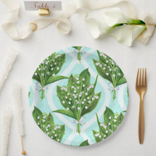 Bouquet of lily of the valley flowers on blue paper plate