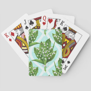 Bouquet of lily of the valley flowers on blue playing cards