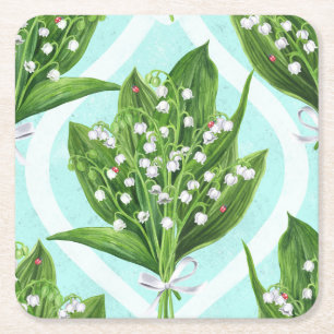 Bouquet of lily of the valley flowers on blue square paper coaster