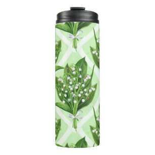Bouquet of lily of the valley flowers on blue thermal tumbler