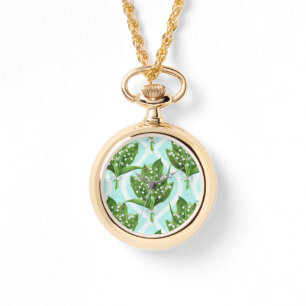 Bouquet of lily of the valley flowers on blue watch