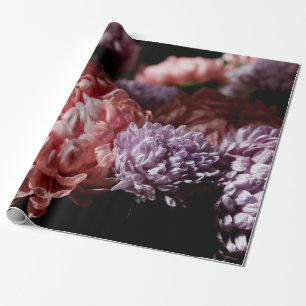 Bouquet of pink with purple aster flowers in light wrapping paper