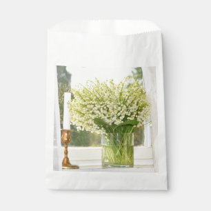 Bouquet of spring flowers lilies of the valley favour bags