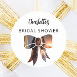 Bow photo Bridal Shower Classic Round Sticker<br><div class="desc">A white background. Decorated with a bow shaped photo frame.  Personalise and add a name. Black handwritten style script.</div>