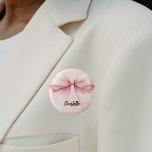 Bow pink name tag 6 cm round badge<br><div class="desc">A soft blush pink coloured background. Decorated with a large bow.  Personalise and add your name.   Black handwritten style script.</div>