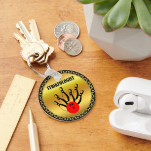 Bowling ball and pins with the word STRIKEOLOGIST Key Ring