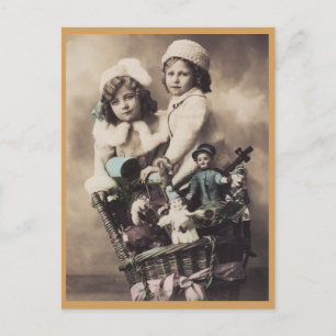 Boy and Girl with Christmas basket of toys vintage Holiday Postcard