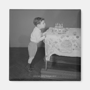 Boy Blowing Out Candles Magnet