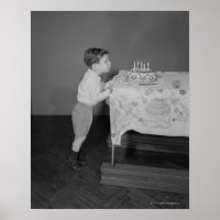 Boy Blowing Out Candles