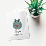 Boys Cute Blue Monster Kids Birthday Party Favour Bags<br><div class="desc">This cute,  fun and modern kids birthday party favour bag design features a blue monster alien,  and can be personalised with your child’s name. The perfect addition to your child’s third birthday party (can be edited for any age).</div>