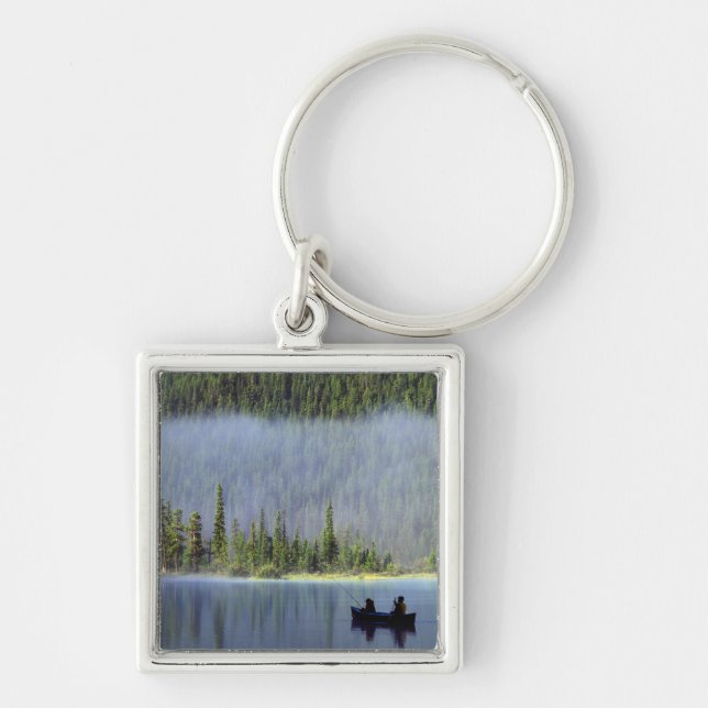 Boys fishing from canoe with mist in key ring (Front)